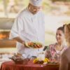 Chef at Enterhealth Ranch inpatient rehab presenting patient with delicious plate of food.